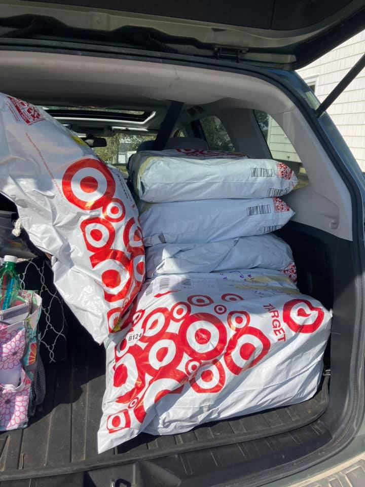 Shopping bags from Target in trunk of vehicle.